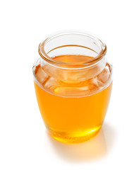 jar of honey on white background