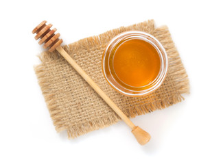 jar of honey on white background