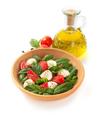 caprese salad in plate on white background