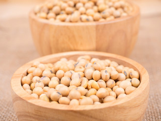 created shot of beans on wooden bowl in studio
