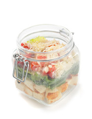 fresh salad in glass jar on white background