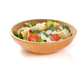caesar salad in plate on white background