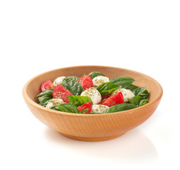 caprese salad in plate on white background