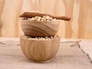 created shot of beans on wooden bowl in studio