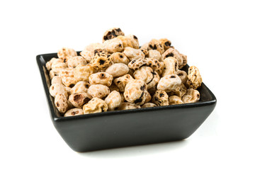 Organic tiger nuts isolated on a white background