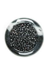 Black beluga lentils isolated on a white background