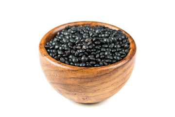 Black beluga lentils isolated on a white background