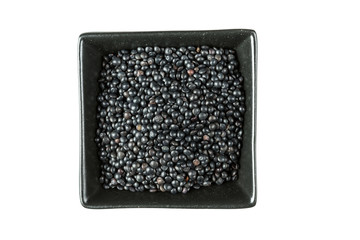 Black beluga lentils isolated on a white background