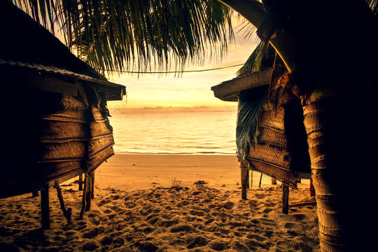 samoa bungalow fale on beach during sunrise and lowtide