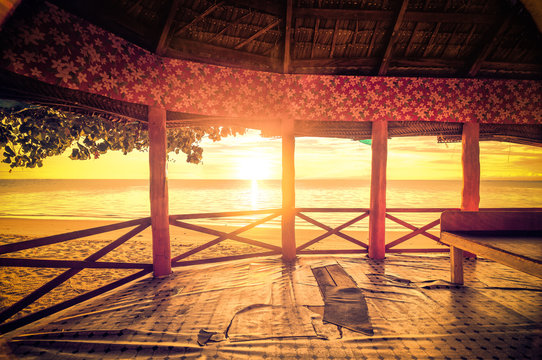 morning sunrise in a bungalow on the beach retro picture