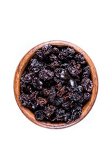 Black organic zante currants isolated on a white background