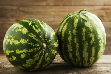 Watermelons on grey wooden table