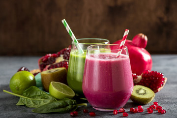 Red and green smoothie with spinach and pomegranate, healthy detox vitamin drink for breakfast