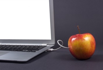 Modern laptop computer on dark background.
