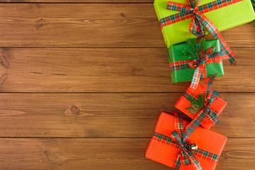 Christmas gift boxes, top view on wood table background.