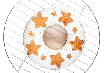 homemade traditional fruit cake on metal stand isolated at white background