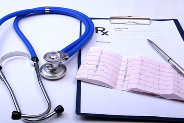 RX prescription, pen and a stethoscope isolated on white background