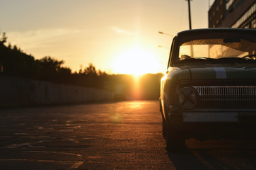 parked old car on background sunrise