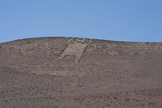 Giant of the Atacama. Large petroglyph on a rocky outcrop in the Atacama Desert in the Tarapaca Region of northern Chile. 