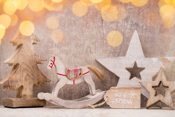 Christmas tree decorations on a wooden background. With bokeh ornaments.