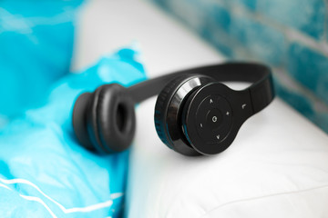 Fototapeta na wymiar headphone lying on pillow for listening relax music