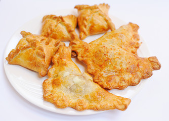 hot samsa on a plate. Caucasian kitchen