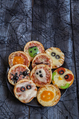 Mini pizzas decorated for a Halloween