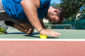 tennis player is squeezing the ball