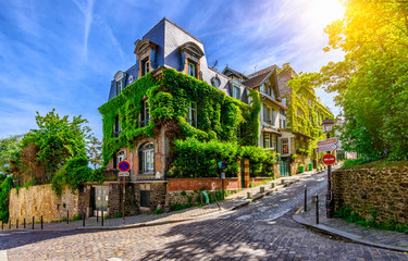 Cozy street of old Montmartre in Paris, France - obrazy, fototapety, plakaty