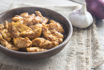 Portion of butter chicken