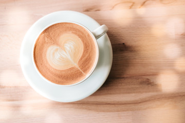 Cappuccino white cup with heart shaped latte art