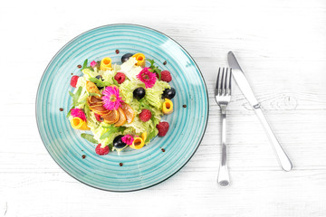 Vegetable salad in a plate. Top view. The concept is healthy food, diet, vegetarianism.