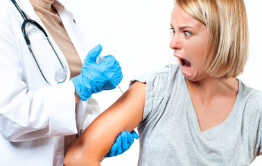 Vaccination. Doctor injecting flu vaccine to patient's arm