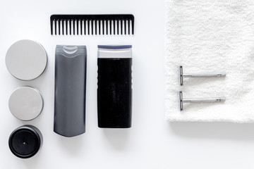 Cosmetics for men's hair on white background top view