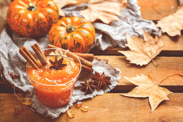 Fototapeta premium Fall autumn pumpkin jam confiture with spices, toned
