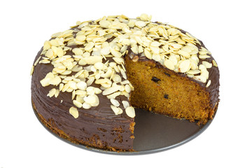 Carrot cake with almond flakes on white background