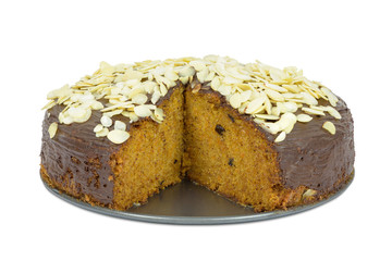 Carrot cake with almond flakes on white background