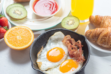 Nutritious breakfast, strawberry, bread, coffee orange juice, sausage, egg