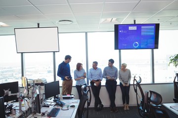 Business colleagues standing at office