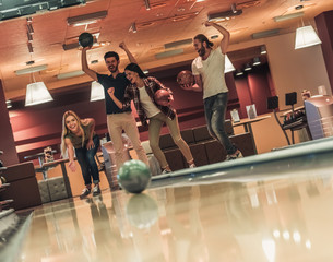 Friends playing bowling