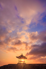 Fototapeta na wymiar Beautiful sunrise on a beach in Bali Indonesia with colourful sky as background