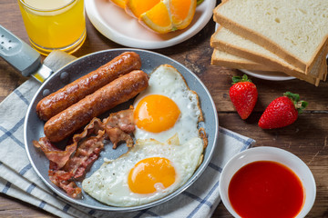 Nutritious breakfast, strawberry, bread, coffee orange juice, sausage, egg