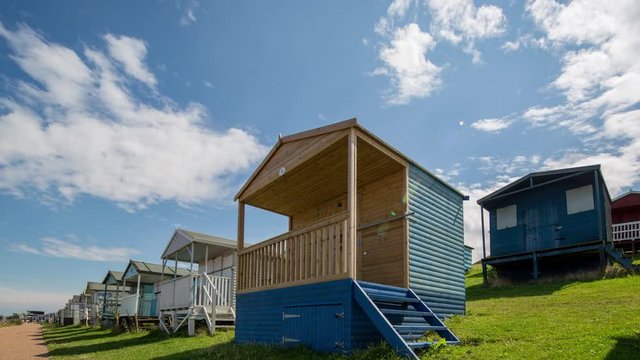 Time lapse of traditional english beach huts in whistable, kent, england on a summer's day