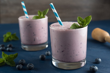 Blueberry smoothies with mint garnish