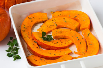 Raw Pieces of pumpkin on a tray.