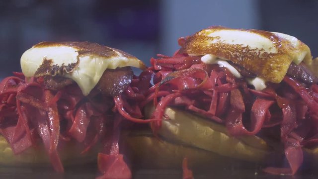 Kumru is a traditional Turkish sandwich on a bun, typically with cheese, tomato, and sausage. Street Food in Izmir Cesme.