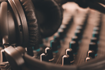 Obraz na płótnie Canvas sound mixer and headphones. recording studio.