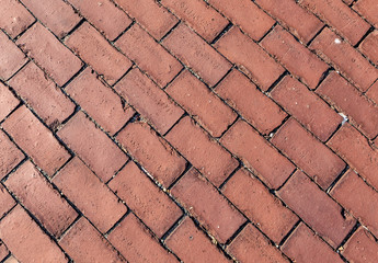 diagonal paved pathway with red brick stones