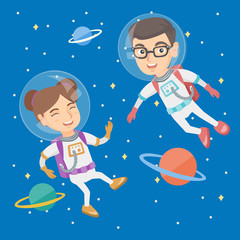 Caucasian astronaut kids wearing space suits and flying in space with planets