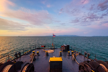 Prow of big passenger boat in the ocean amidst the beautiful nature of the evening sea and the colorful sky during sunset while cruising to Koh Samui Island in Surat Thani, Thailand